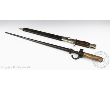 A British Wilkinson 1907 pattern rifle bayonet and scabbard, 55cm long with a further bayonet and sheath stamped '9 54311', 6