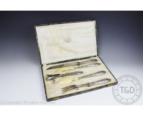 A French silver handled five piece carving set retailed by Manche Argent Paris, comprising; a carving knife and fork, a bone 