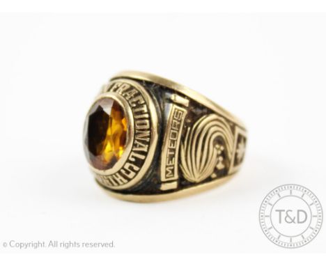 An unusual American gents signet ring, set with a central citrine, with 'Thornton Fractional North' dated '1974' and bearing 