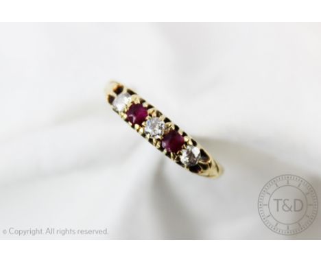 A George V ruby and diamond five stone ring, Birmingham 1911, set in 18ct yellow gold, designed as three diamonds and two rub