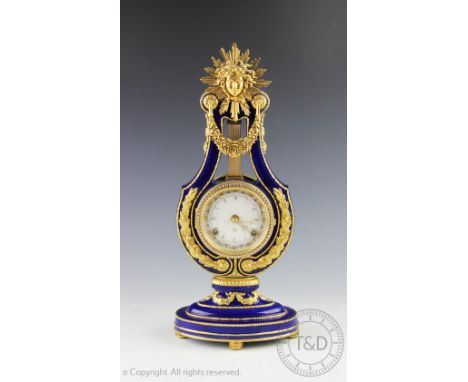 A Victorian and Albert Museum Marie Antoinette style clock, of lyre shape, with movement striking on two bells, 39cm