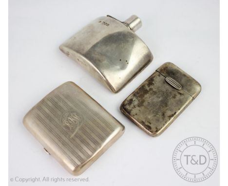 An Edwardian concave silver hip flask, Goldsmiths and Silversmiths Co Ltd London 1901, of plain polished form and with bayone