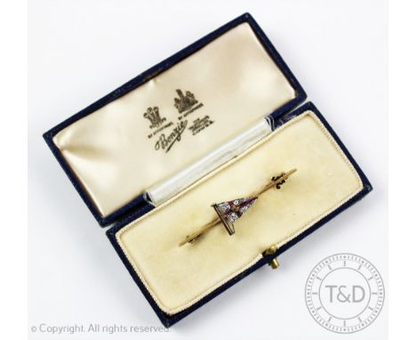 A diamond and ruby set burgee brooch for the Royal Yacht Squadron by Benzie of Cowes, set with a central enamelled crown, to 