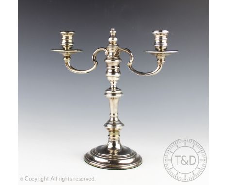 A silver candelabra, William Comyns & Sons Ltd, London 1967, the twin branch supported by a turned set and raised on a steppe