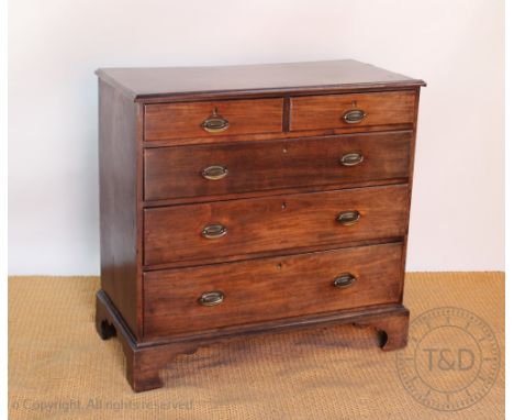 An early 19th century mahogany chest, of two short and three long drawers, on bracket feet, 98cm H x 101cm W x 51cm D