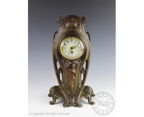 A French Art Nouveau mantel clock, the bronzed case with scroll base and figural floral casting enclosing an Arabic numeral d