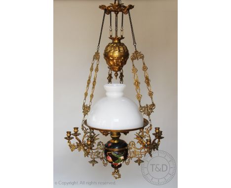 A late 19th century continental gilt brass oil ceiling light, Majolica style reservoir moulded with flowers (base section at 