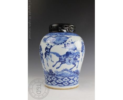 A Chinese porcelain blue and white vase, 19th century, the baluster vase decorated with warriors and horseback figures in the