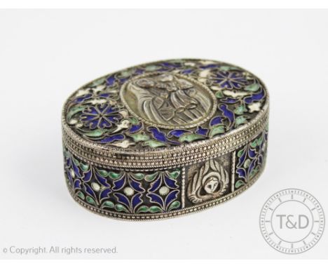An Eastern white metal and cloisonne enamelled box and cover, the oval box set to the cover with an a vignette depicting Moda