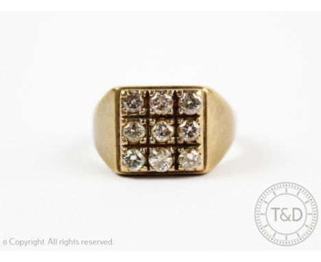 A diamond set signet ring, designed as a square panel of nine brilliant cut diamonds, all set in yellow metal stamped '9ct', 