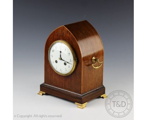An Edwardian rosewood lancet shaped eight day mantel clock, circular white enamel dial with black Arabic numerals, movement s