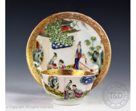 An 18th century style tea bowl and saucer, each decorated with figures on a veranda, with gilt yunwen borders, saucer 15.5cm 