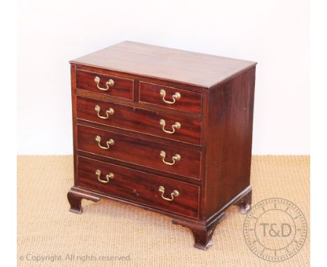 A George III style mahogany and pine chest, of small proportions, with two short and three long drawers, on ogee bracket feet