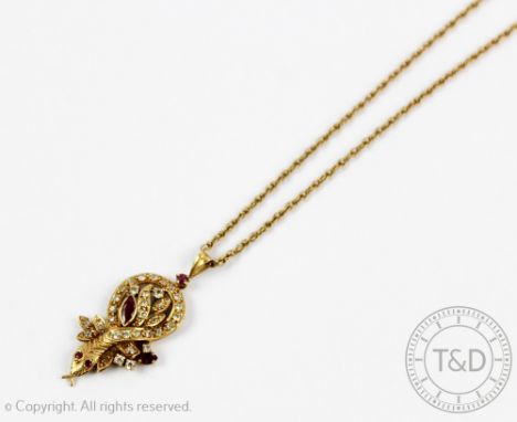 A ruby and diamond set Eastern 'Snake' pendant and attached chain, the snake set throughout with rubies and diamonds, indisti