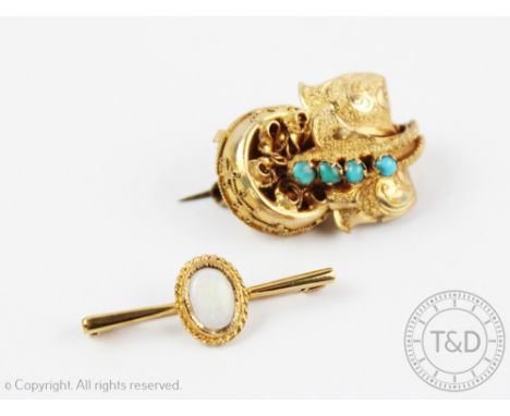 A Victorian turquoise set brooch (converted from an earring) of foliate form and a 9ct yellow gold brooch set with a central 