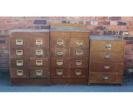 Two vintage school banks of drawers, each with eight drawers on plinth base, larger 94cm H x  51cm W x 57cm D, with a smaller