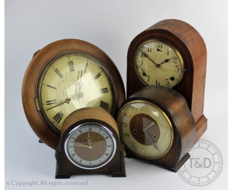 A late 19th century postmans clock, with Roman numeral dial and movement striking on a bell, 30.5cm diam, with three other cl