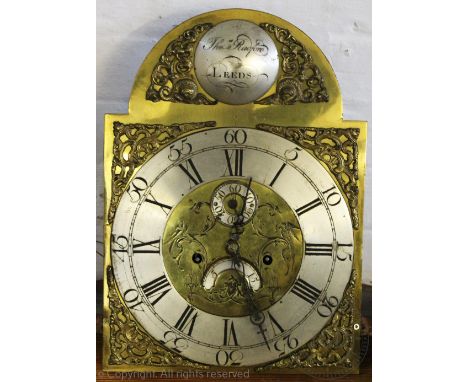 An early 19th century inlaid oak eight day longcase clock, the engraved brass dial with silvered Roman numeral chapter ring, 