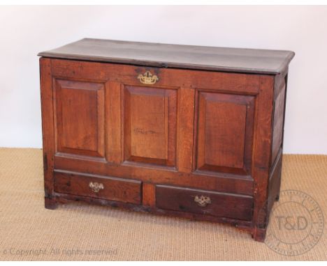 A George III oak mule chest, with hinged top and two drawers, on later bracket feet, 78cm H x 111cm W x 52cm D