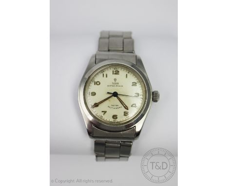 A Tudor Oyster Prince wristwatch, the stainless steel case enclosing circular champagne dial with Arabic numerals and cebtre 