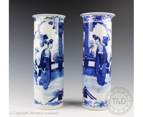 An associated pair of 19th century Chinese porcelain blue and white beaker vases, each decorated in cobalt blue with figures 