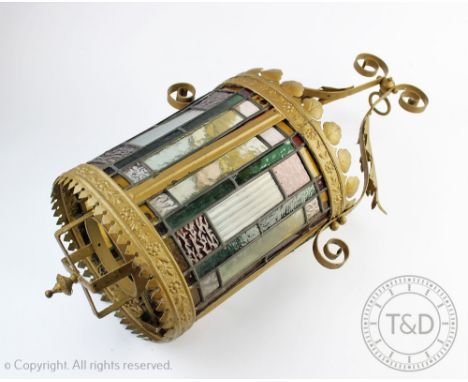 A late Victorian gilt metal and stained glass oval hall lantern, (at fault), 63cm   CONDITION REPORT:  The metal has a later 