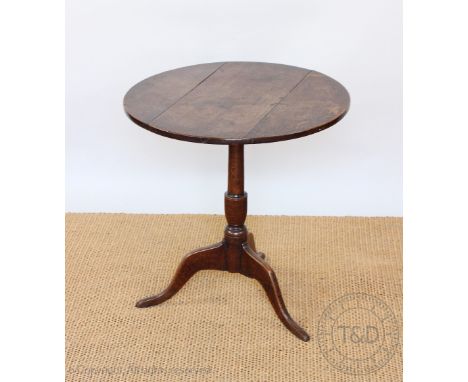 A George III circular oak occasional table, with three plank top, on tripod base, 66cm H x 64cm Diameter