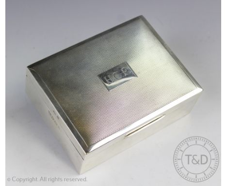 A silver cigarette case, Baker Ellis Silver Co, Birmingham 1968, with engine turned detailing and initialled HCP to the top, 