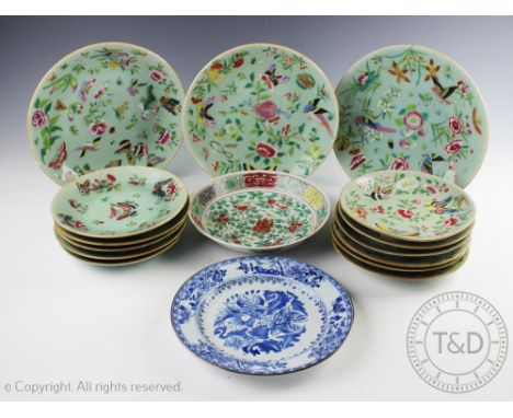 Three famille rose plates, decorated with flowers and insects against a celadon ground, 25cm diameter, with eleven smaller pl