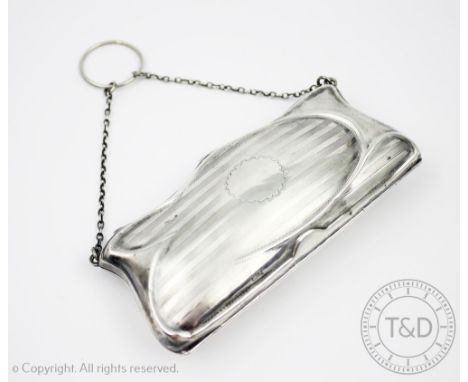 A George V silver purse, Chester 1914 (makers mark rubbed), with engine turned detail and vacant cartouche, red leather inter