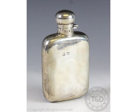 An Edwardian silver hip flask, Sheffield 1903, 2.9oz gross, 11cm CONDITION REPORT: Hallmarks rubbed but still partially legib