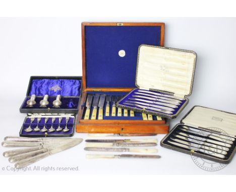 A cased set of twelve plus eleven ivory handled knives and forks, within fitted Harvey and Gore mahogany case, each handle wi