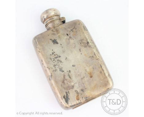A silver hip flask, Chester early 20th century, marks rubbed, with concave back and bayonet top, 13cm high CONDITION REPORT: 
