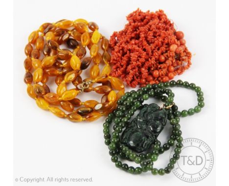 A single strand amber coloured bead necklace, the beads on knotted string, gross weight 41.3gms with a jade coloured necklace