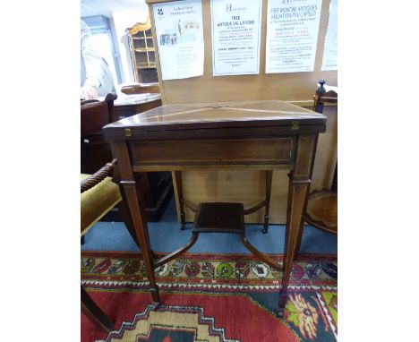 An Edwardian mahogany envelope card table, in the manner of Thomas Sheraton, inlaid with boxwood, ebony and satinwood crossba