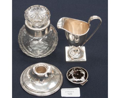 A George V silver cream jug, Neo-Classical, Grecian helmet form with strap handle on square base, Birmingham 1916, together w