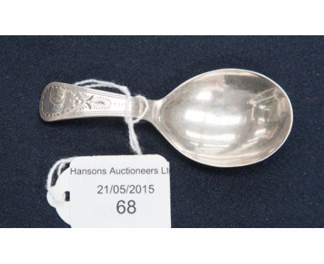 A George III silver caddy spoon, circa 1806, decorated with bright cut decoration 