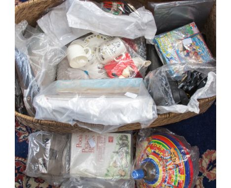 A basket of vintage toys to include a lacquered box of marbles, annuals, Batman figure, writing slate and three money boxes, 