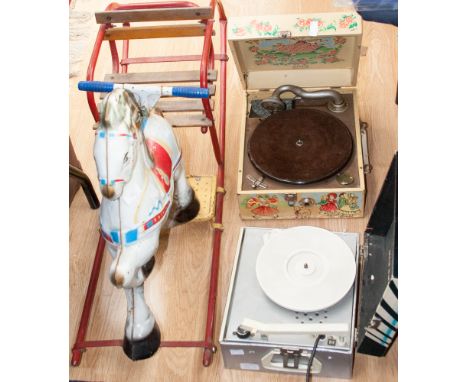 Two vintage children's record players, a Louis Marx boxed pro shot golf game and a Triang Mobo style tinplate rocking horse a