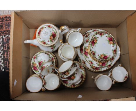 A Royal Albert Country Roses tea service with teapot and extras one box including calendars plates