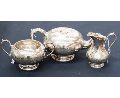 A silver plated and engraved three piece tea service 