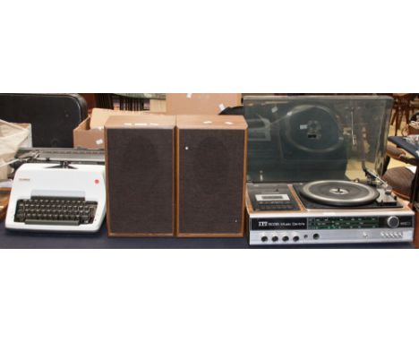 An Olympia typewriter and an ITT 1970s music centre with stereo speakers 