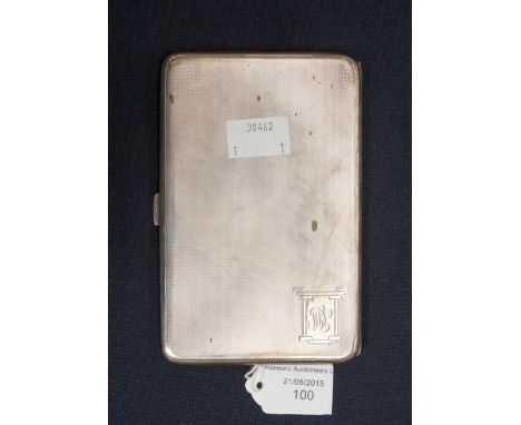 A George V silver cigarette case, Birmingham 1932, the front bearing an Art Deco inscribed cartouche, with engine turning to 