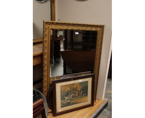 An early 20th Century beach framed oval mirror, a large rectangular bevelled glass gilt framed mirror, a print and wicker bas