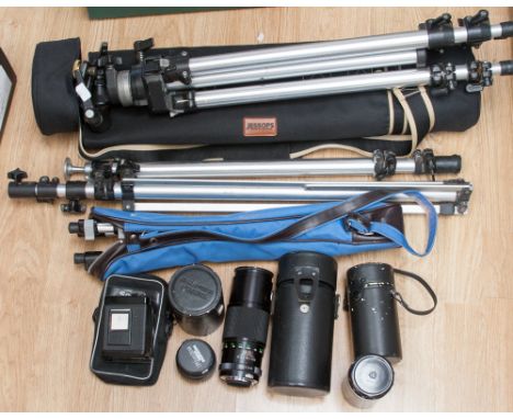 A collection of camera equipment, including a Bronica 120 back, large Manfrotto tripod with other tripods and stand, five len