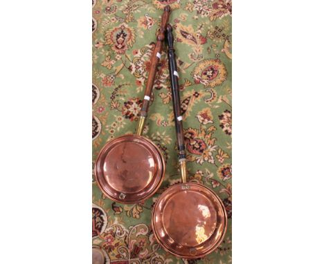 A collection of metalware, including copper warming pans, jam pans, copper kettle etc