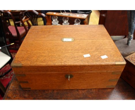An oak Army and Navy campaign box