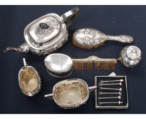 A silver backed hair brush, embossed with Reynolds angels; together with a three piece plated tea set, tea caddy, etc  