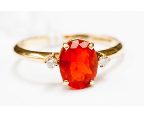 A fire opal and diamond ring 