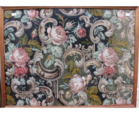 A mid Victorian woolwork panel, believed to have been made during the 1860's fitted in an oak frame, 65 cm high by 87 cm wide